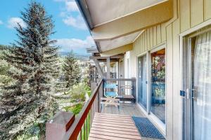 a porch of a house with a christmas tree at Woodbridge 30 in Snowmass Village