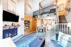 a living room with a fireplace and a tv at Elkhorn Studio Condo - The Clocktower in Sun Valley