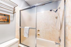 a shower with a glass door in a bathroom at Elkhorn Studio Condo - The Clocktower in Sun Valley +47 photos