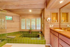 a bathroom with a green tiled tub and a shower at Sunny Side Lodge in Ketchum +58 photos