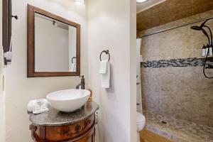 a bathroom with a sink and a shower at Elkhorn Angani 54 in Sun Valley +23 photos