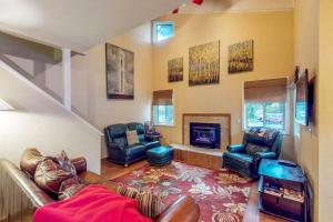 a living room with a couch and a fireplace at Pinewood Getaway in Ketchum