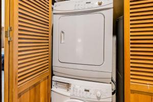 a washing machine sitting on top of a toilet at Bridgepoint Condo on Trail Creek in Ketchum