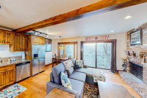 a living room with a couch and a fireplace at Ideal in Idaho in Ketchum