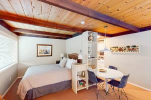 a bedroom with a bed and a table and chairs at Delightful Atelier Getaway in Sun Valley +63 photos