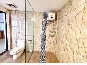 a bathroom with a toilet and a shower at Serenity Nirvana Palace -Private Rooms & Suitable for families Jimbaran in Jimbaran +23 photos