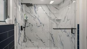 a bathroom with a marble shower with a glass door at Stone Ridge by AvantStay in Albrightsville +44 photos