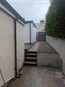 a set of stairs leading up to a building at Grange Retreat in Pontnewydd