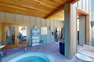 a building with a hot tub in a patio at Keystone Condo 8380 in Keystone +45 photos