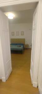 a room with a bed in the middle of a room at Civico 16 in Sulmona
