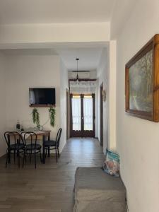a living room with a table and a dining room at Naia House in Chorefto