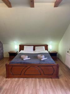 a bedroom with a bed with two pillows on it at Guest House Naglis in Neringa
