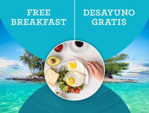 a plate of food with eggs and bread on a beach at PASADENA VIBES - VILLAS and SUITES - playa LOS CORALES in Punta Cana