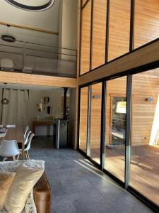 a room with a bed and a table and some glass at le chalet de st Anne in Jausiers +21 photos