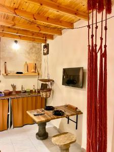 a kitchen with a wooden table in a room at Timber House Dahab in Dahab