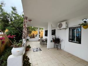 a patio of a house with potted plants at Dar halouma in Tabarka