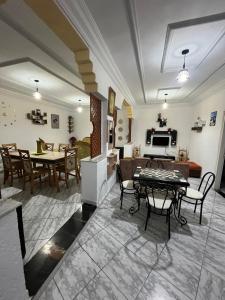 a living room with a table and chairs at Dar halouma in Tabarka