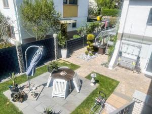 an aerial view of a patio with a table and umbrella at Apartment Lahn-Paradies by Interhome in Aull
