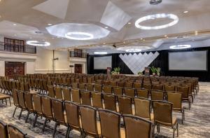 a large room with rows of chairs and a stage at Hilton Phoenix Resort at the Peak in Phoenix +41 photos