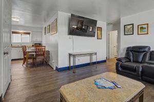 a living room with a couch and a table at 410 e 45th ave unit 4 in Anchorage