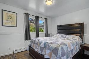 a bedroom with a bed and a window at 410 e45th 2 bedroom apartment in Anchorage