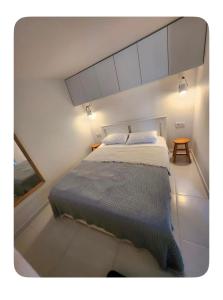 a bedroom with a large bed in a room at Nunu GARDEN Urla in Urla