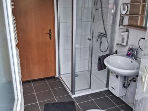 a bathroom with a shower and a sink at Holiday Home L by Interhome in Kövenig