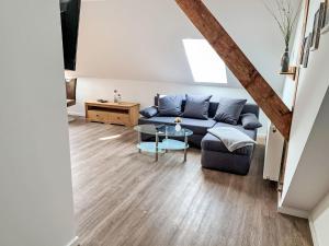 a living room with a couch and a table at Apartment Baltrum by Interhome in Westerholt