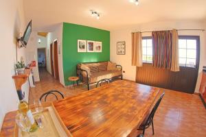 a living room with a table and a couch at Casa La Tabona in Frontera
