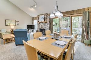 a dining room and living room with a table and chairs at Only 8/22-8/29 Still Available for Summer 2026! in Harbor Springs