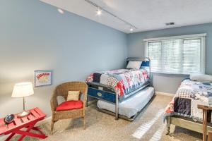 a bedroom with a twin bed and a chair at Only 8/22-8/29 Still Available for Summer 2026! in Harbor Springs +22 photos