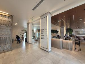 a lobby of a store with a sign in the middle at Novotel Arica in Arica +130 photos