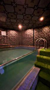 a indoor swimming pool in a building at brick hotel & luxury suites in Lahore