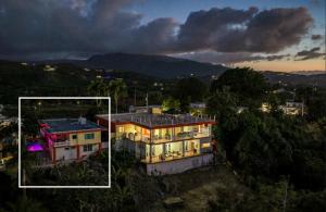 an aerial view of a house at night at Villa Marbella - Ocean Views & Private Pool in Luquillo