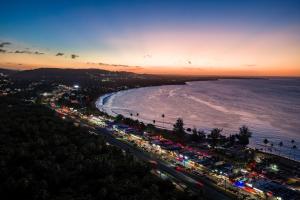 a busy beach with a lot of traffic at night at Villa Marbella - Ocean Views & Private Pool in Luquillo