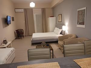 a room with a bed and a living room with a couch at Cozy & modern apartment! in Kiaton