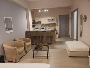 a living room with a couch and a table at Cozy & modern apartment! in Kiaton