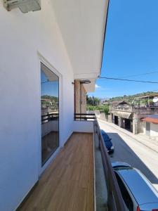 a balcony with a view of a building at VILA 32 in Berat