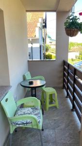a patio with two chairs and a table and a table at Djurdja Apartment in Arandelovac