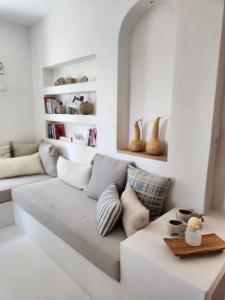a living room with a couch and a table at Nunu HOUSE Urla in Urla