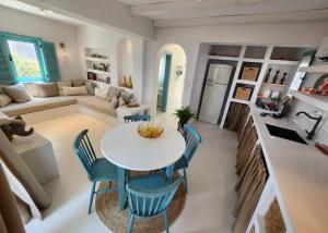 a kitchen and living room with a table and chairs at Nunu HOUSE Urla in Urla
