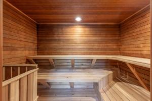 an empty sauna with wooden walls and wooden floors at Pines #2163 in Keystone