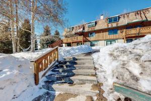 a staircase covered in snow in front of a building at Shredders & Hikers Delight in Vail