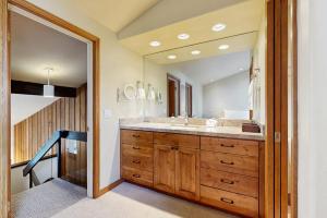 a bathroom with a sink and a large mirror at Mountain Magic in Ketchum