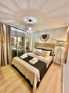 a bedroom with a large bed in a room at Artion Jacuzzi Villa Nikiti in Nikiti