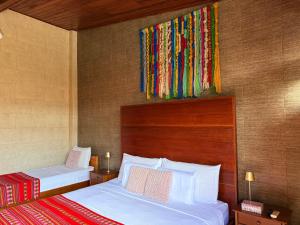 a hotel room with two beds in a room at Casa Micaela in Iquitos +20 photos