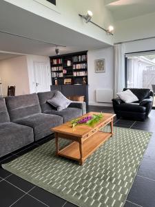 a living room with a couch and a coffee table at Leac na Cille in Dingle