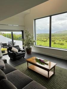 a living room with a couch and a table at Leac na Cille in Dingle