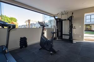 a gym with cardio equipment on the roof of a building at Oka Milagres Beachfront Condominium By MME in Barra do Camaragibe +5 photos