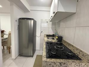 a kitchen with a stove top oven in a kitchen at RESIDENCIAL MORADA DO VALE 03b in Garanhuns